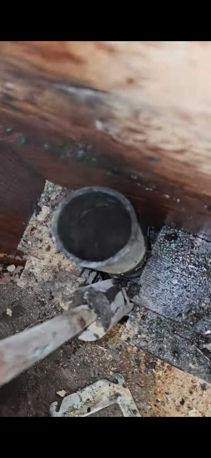 After chain cleaning showing a cleaner drain interior and restored opening